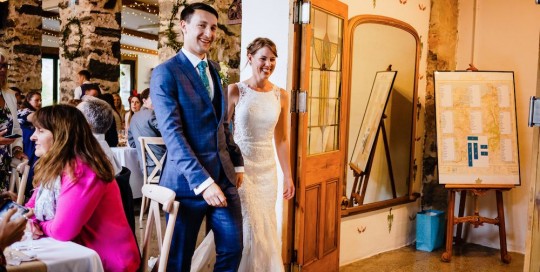 Cris Lowis photo of wedding couple at foyer entrance to Llyn Gwynant Big barn